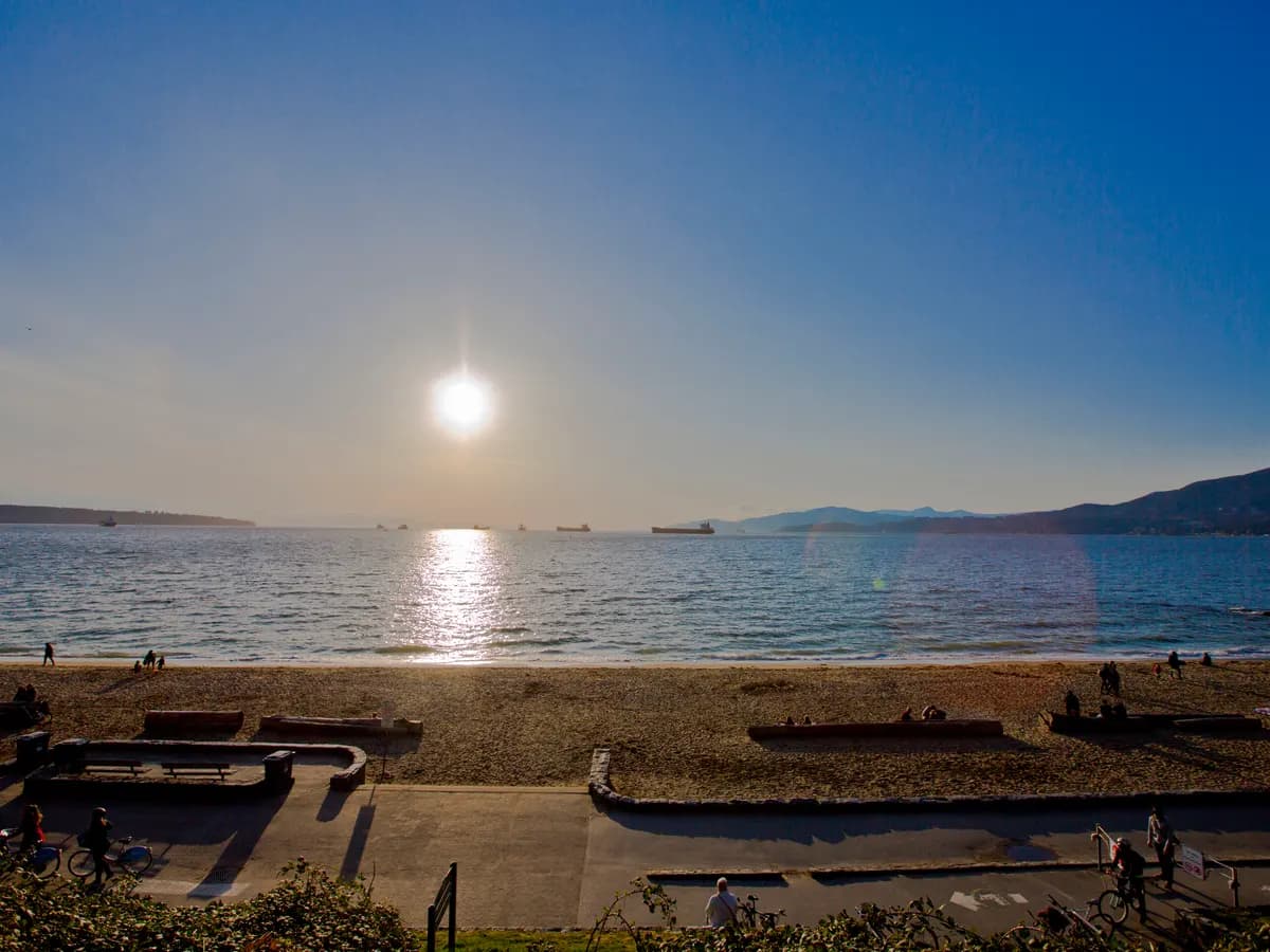 Low sun over English Bay from Third Beach