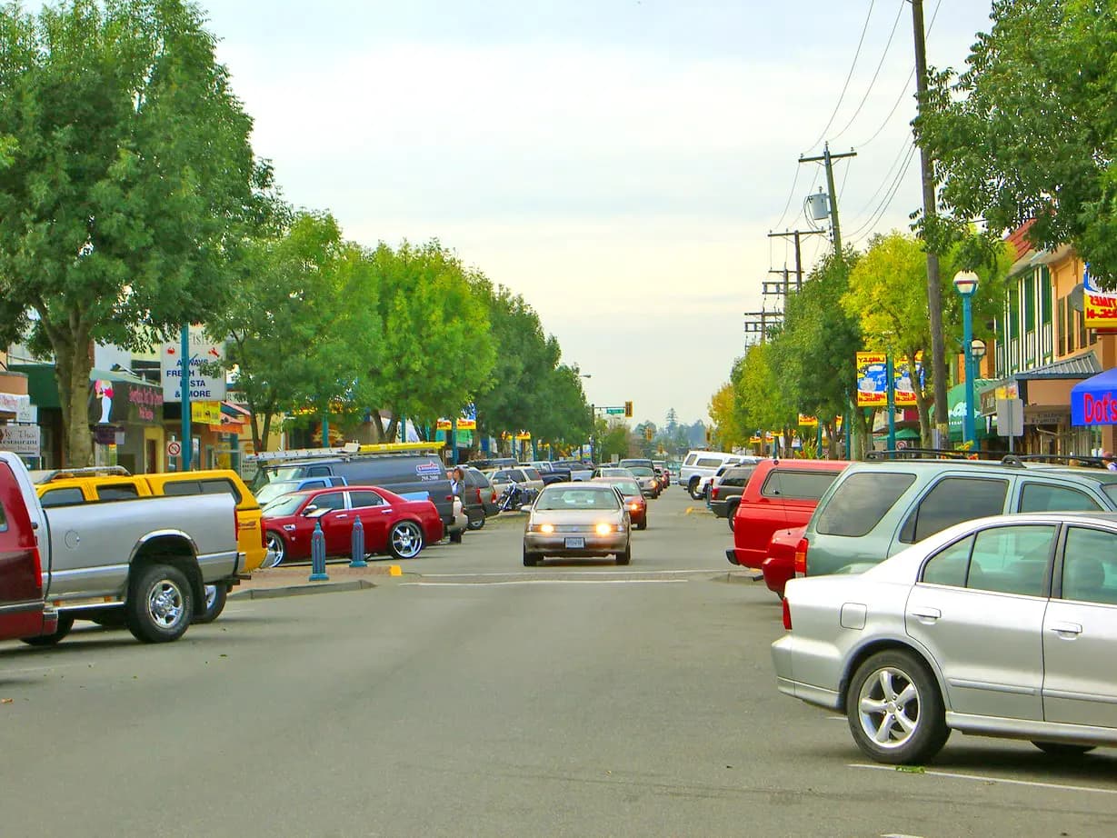 The one-way section of Fraser Highway in Langley City, lined with shops and restaurants
